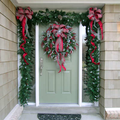 Christmas Door decorated with a Lush Garland and Wreath